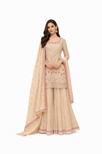 Model wearing champagne blush sharara suit with dupatta – Khush Mizaj
