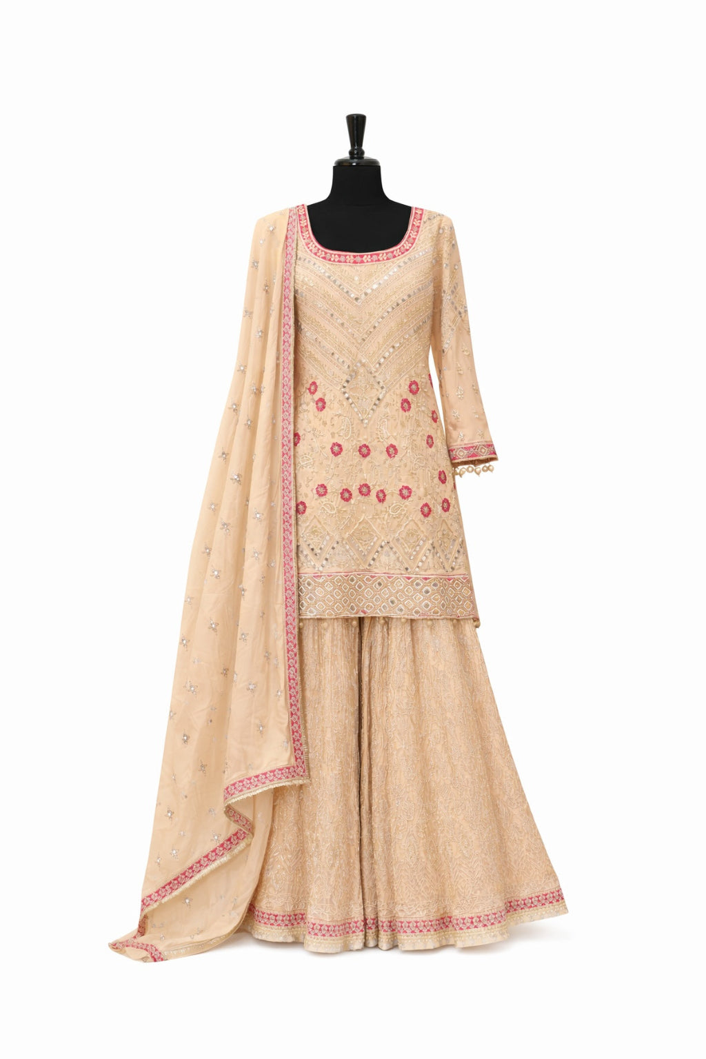 Beige embroidered traditional outfit with a dupatta on a mannequin against a white background