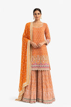 Model wearing orange embroidered sharara suit – Khush Mizaj