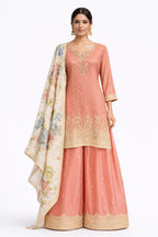 Model wearing peach floral sharara set with printed dupatta – Khush Mizaj