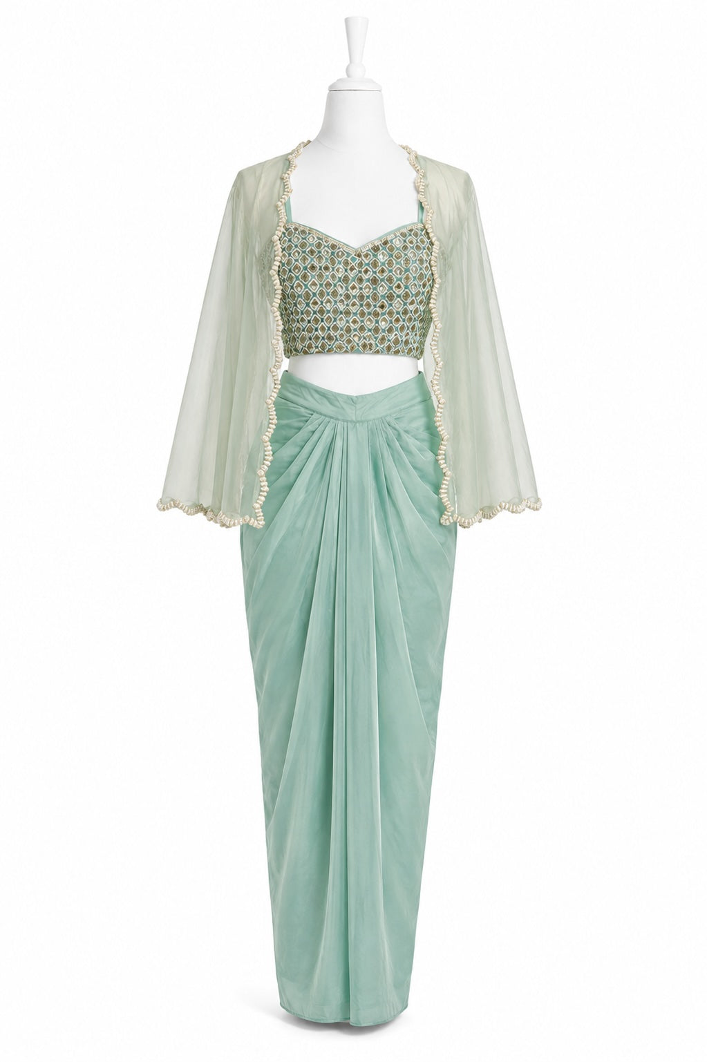 Mint green dhoti skirt with a matching blouse on a mannequin against a white background