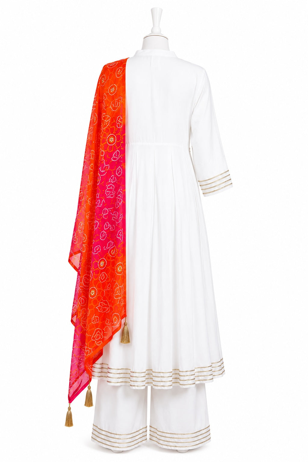 White traditional outfit with a red and orange dupatta on a mannequin against a white background