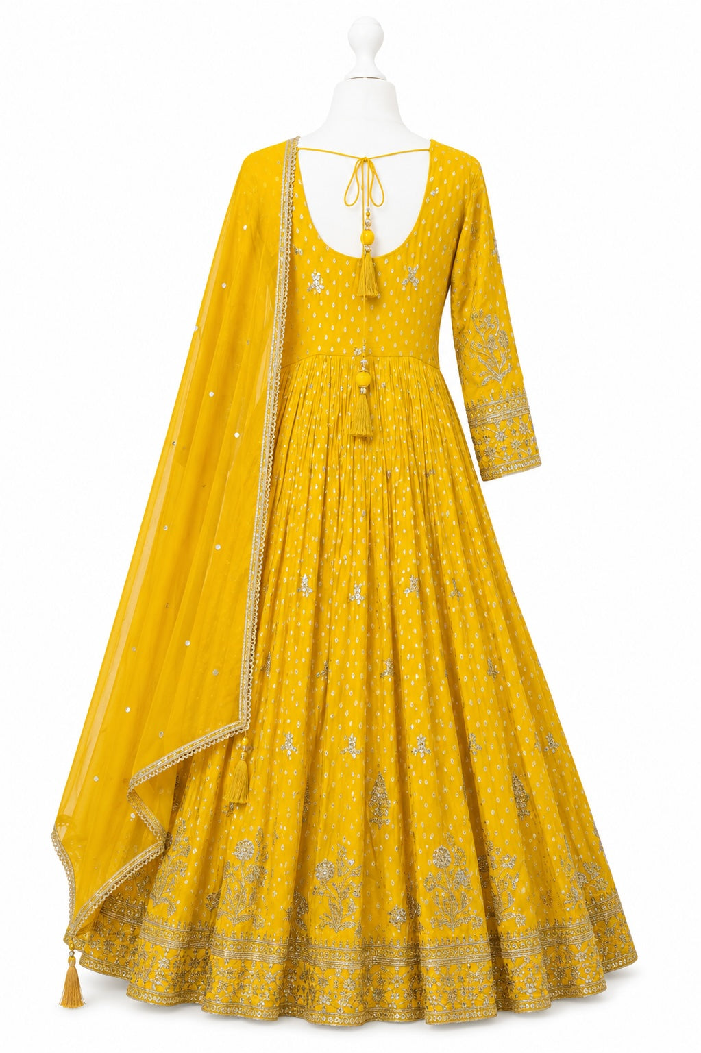 Yellow embroidered dress with dupatta on a mannequin against a white background