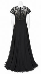 Black evening gown with lace cap sleeves on a mannequin against a white background