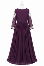 Purple evening gown with floral embellishments on sleeves against a white background