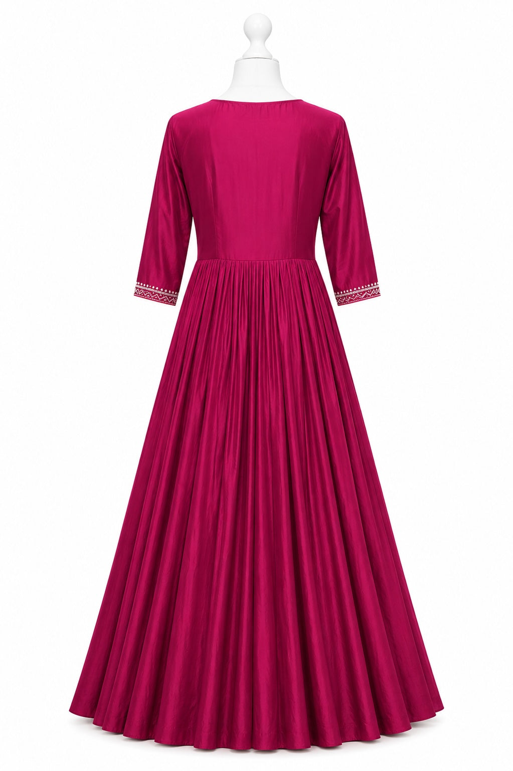 Fuchsia dress with white trim on a mannequin against a white background