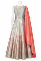 Mannequin wearing a silver dress with pink floral patterns and a matching pink dupatta on a white background