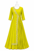 Yellow dress with intricate embroidery on a white background