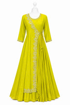 Yellow dress with intricate embroidery on a white background