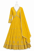 Yellow embroidered anarkali suit on a mannequin with a white background