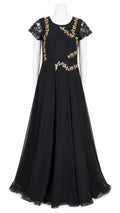 Black evening gown with gold embroidery on a white background