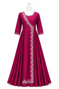 Magenta dress with white embroidery on a mannequin against a white background
