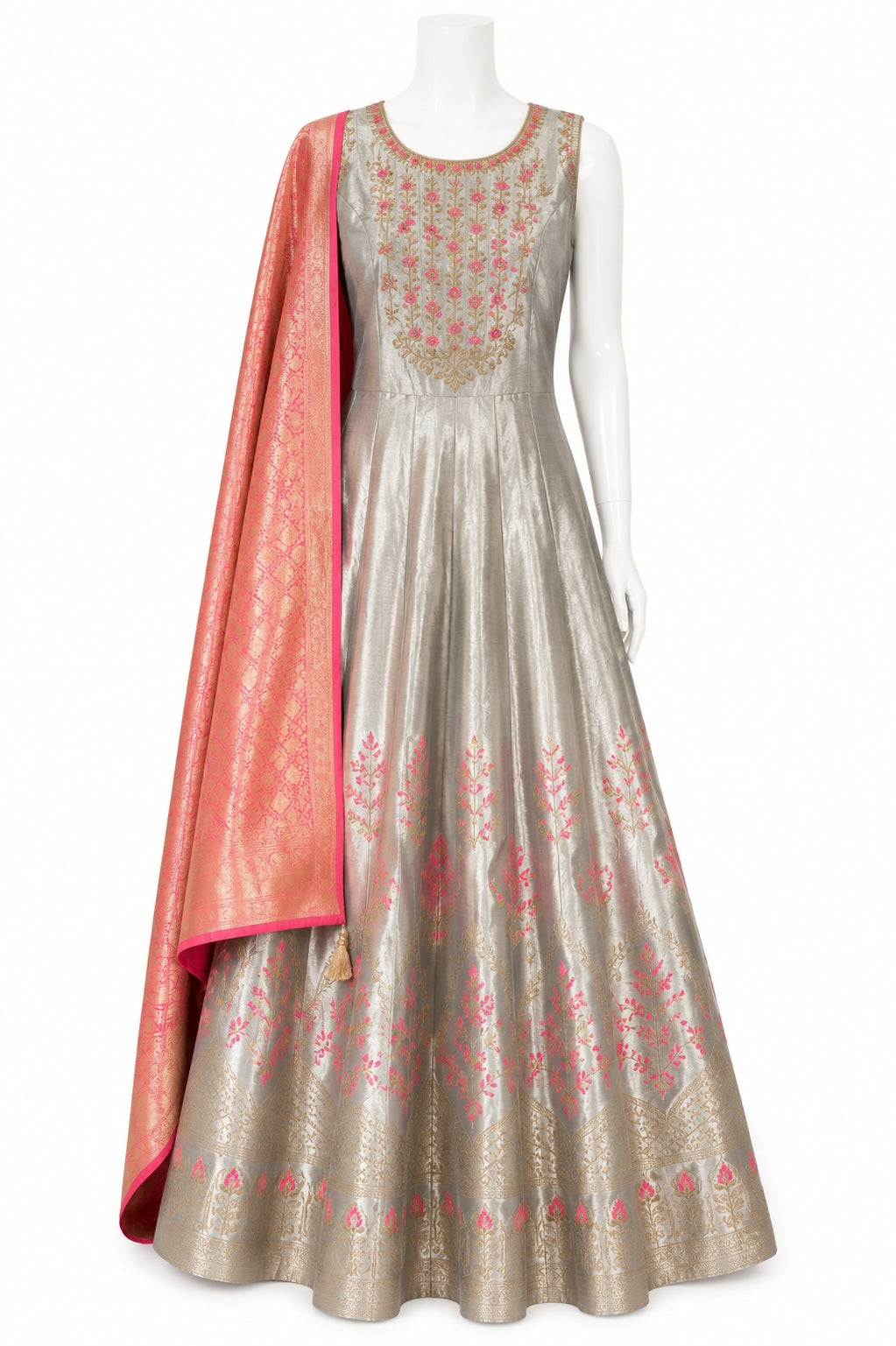 Traditional Indian outfit with a silver anarkali suit and pink dupatta on a white background