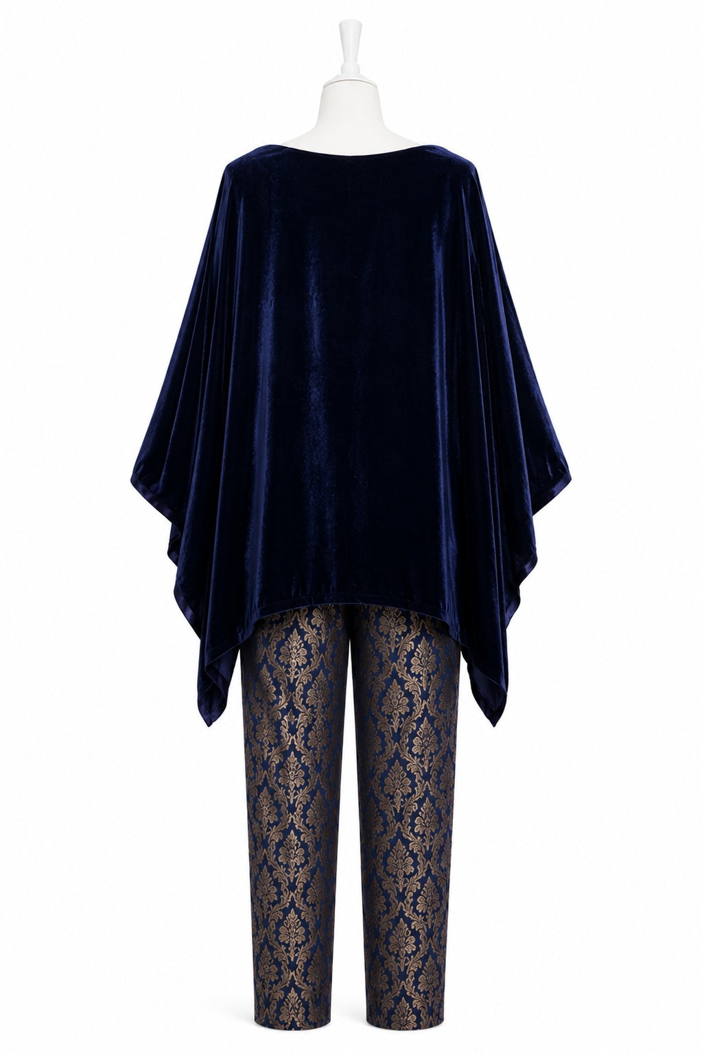 Navy velvet poncho over lace pants on a mannequin against a white background