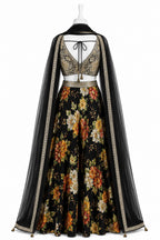 Floral dress with a black cape on a white background