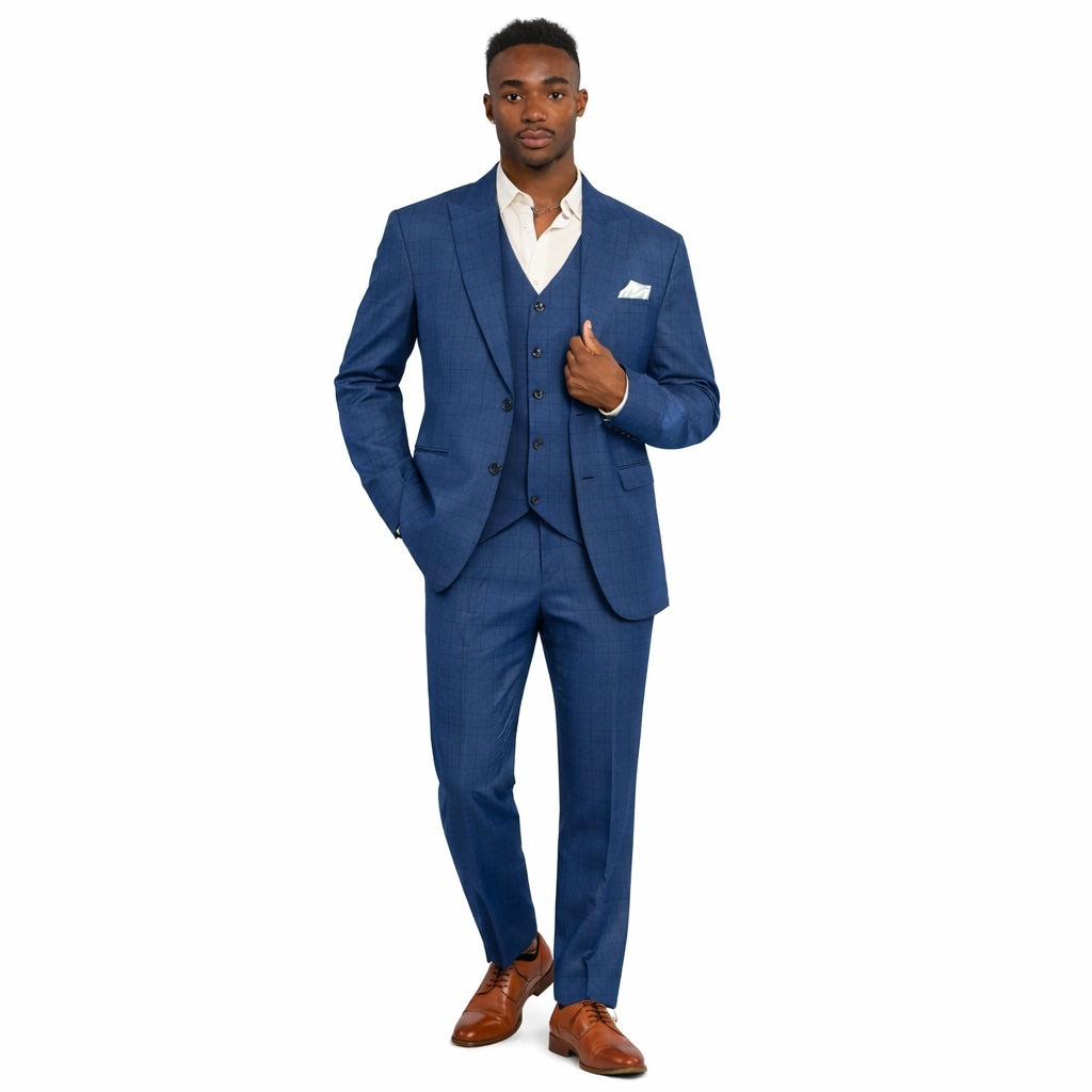 Man wearing a blue suit with a white shirt and brown shoes on a white background