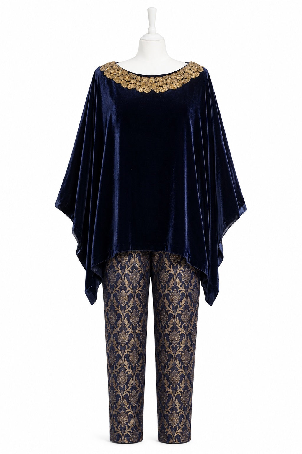 Navy velvet top and patterned pants on a mannequin against a white background