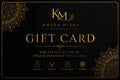 A black gift card with elegant gold typography and ornate mandala-style corner details. The card prominently displays the brand name 'KM' and 'Khush Mizaj Official', with the words 'GIFT CARD' in large gold letters.