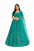 Teal traditional outfit with matching dupatta on a white background