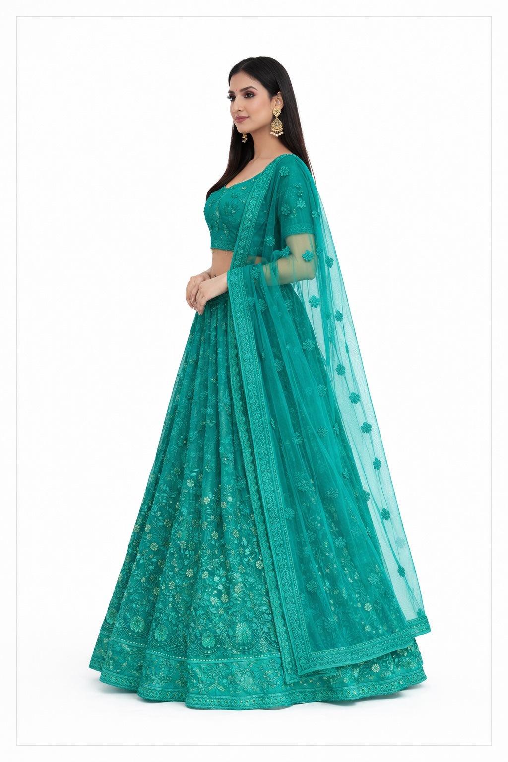 Teal saree with matching blouse on a white background