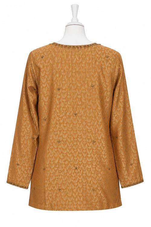 Brown patterned dress on a mannequin against a white background