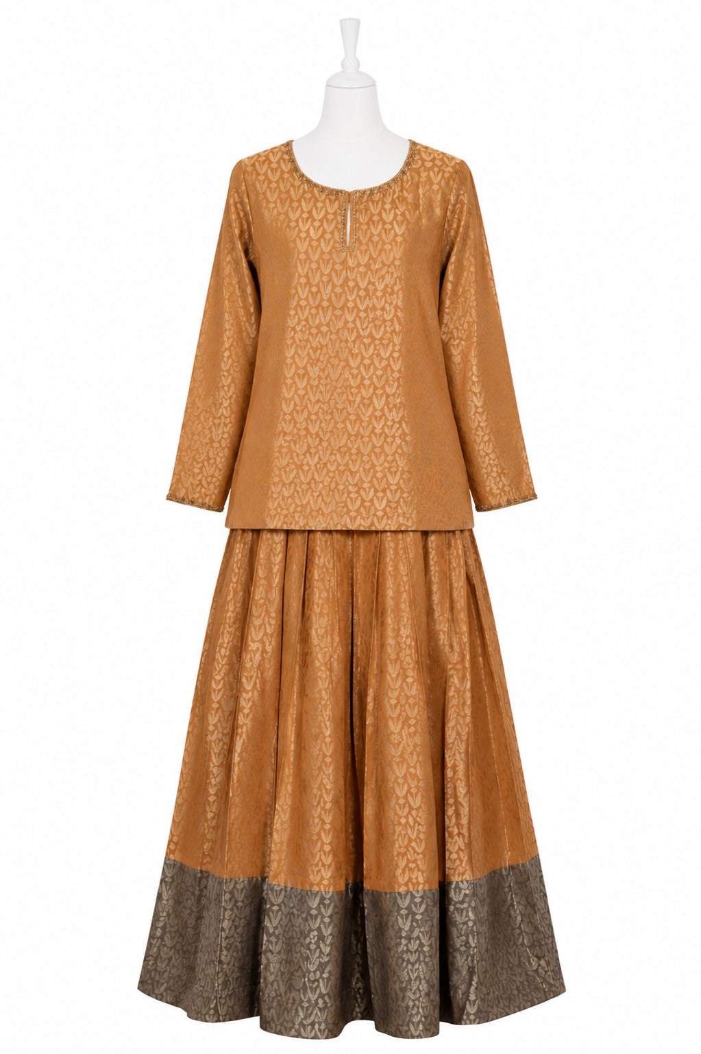 Brown patterned outfit on a mannequin against a white background