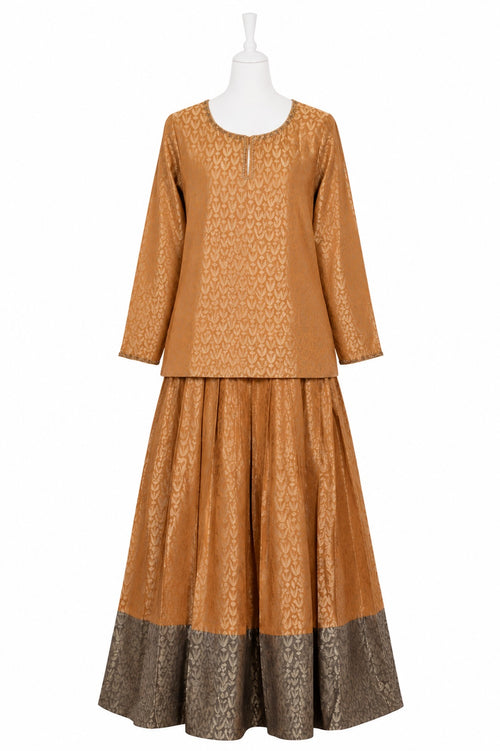Brown patterned outfit on a mannequin against a white background