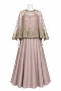 A dusty pink traditional Indian outfit displayed on a white mannequin, featuring a sheer embroidered kurta with wide bell sleeves and a matching pleated skirt.