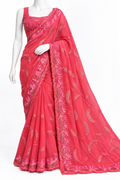 A bright pink georgette saree with metallic gold floral embroidery, displayed on a white mannequin against a plain white background.