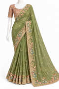 An olive green saree with intricate floral embroidery in gold, pink, and teal, paired with a matching beige embroidered blouse, displayed on a white mannequin against a plain white background.