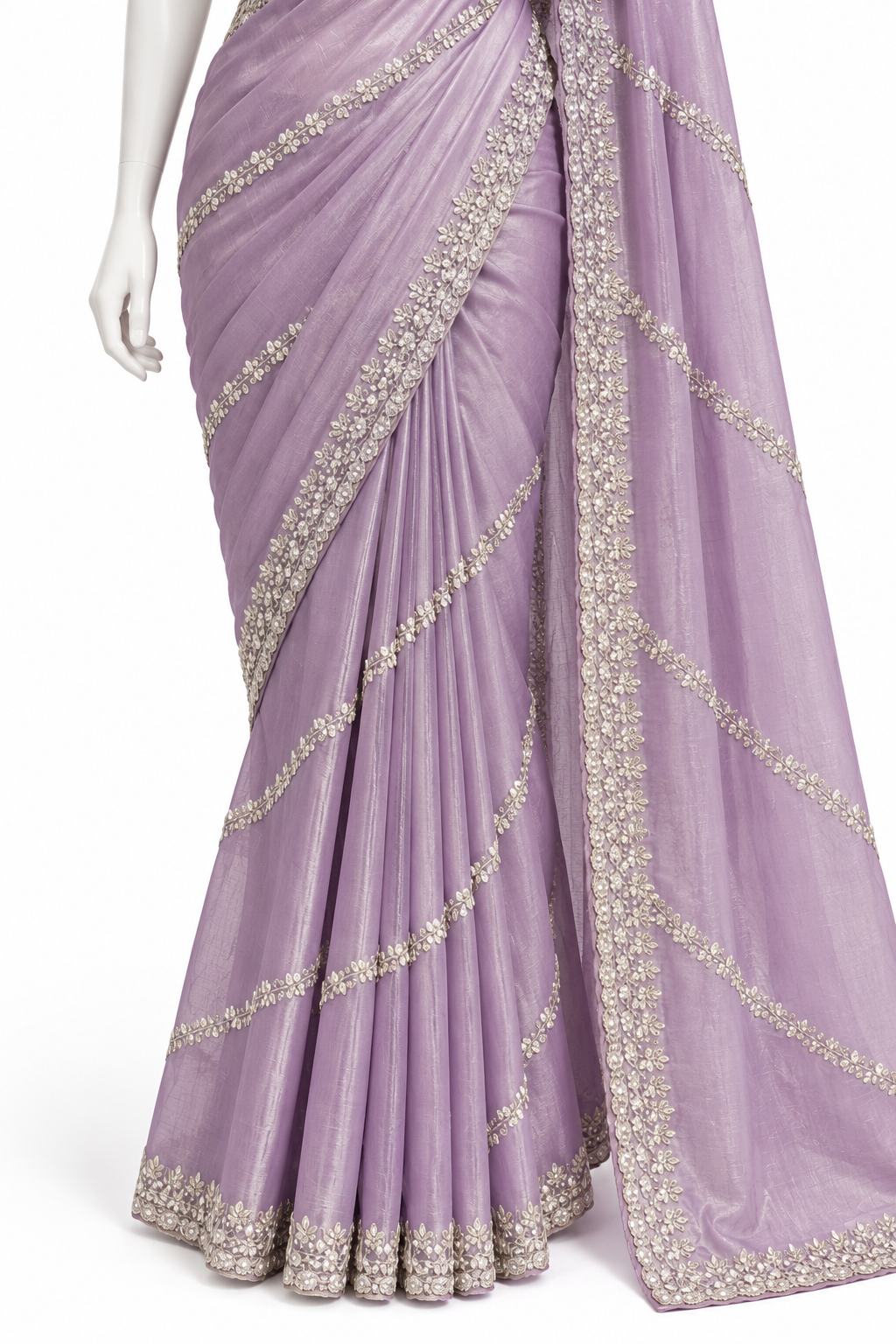 A lavender purple saree with intricate silver and gold embroidery, displayed on a white mannequin against a white background.