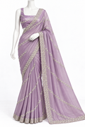 A lavender purple georgette saree with silver floral embroidery, draped on a white mannequin against a plain white background.