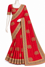 A red traditional Indian saree with gold elephant and floral motifs, displayed on a white mannequin against a plain white background.