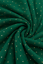Dark green crinkled fabric with small scattered gold sequins, arranged in a spiral drape pattern.