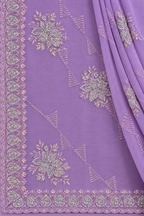Purple georgette saree fabric with silver and gold zari floral embroidery and a decorative border, shown with the drape.