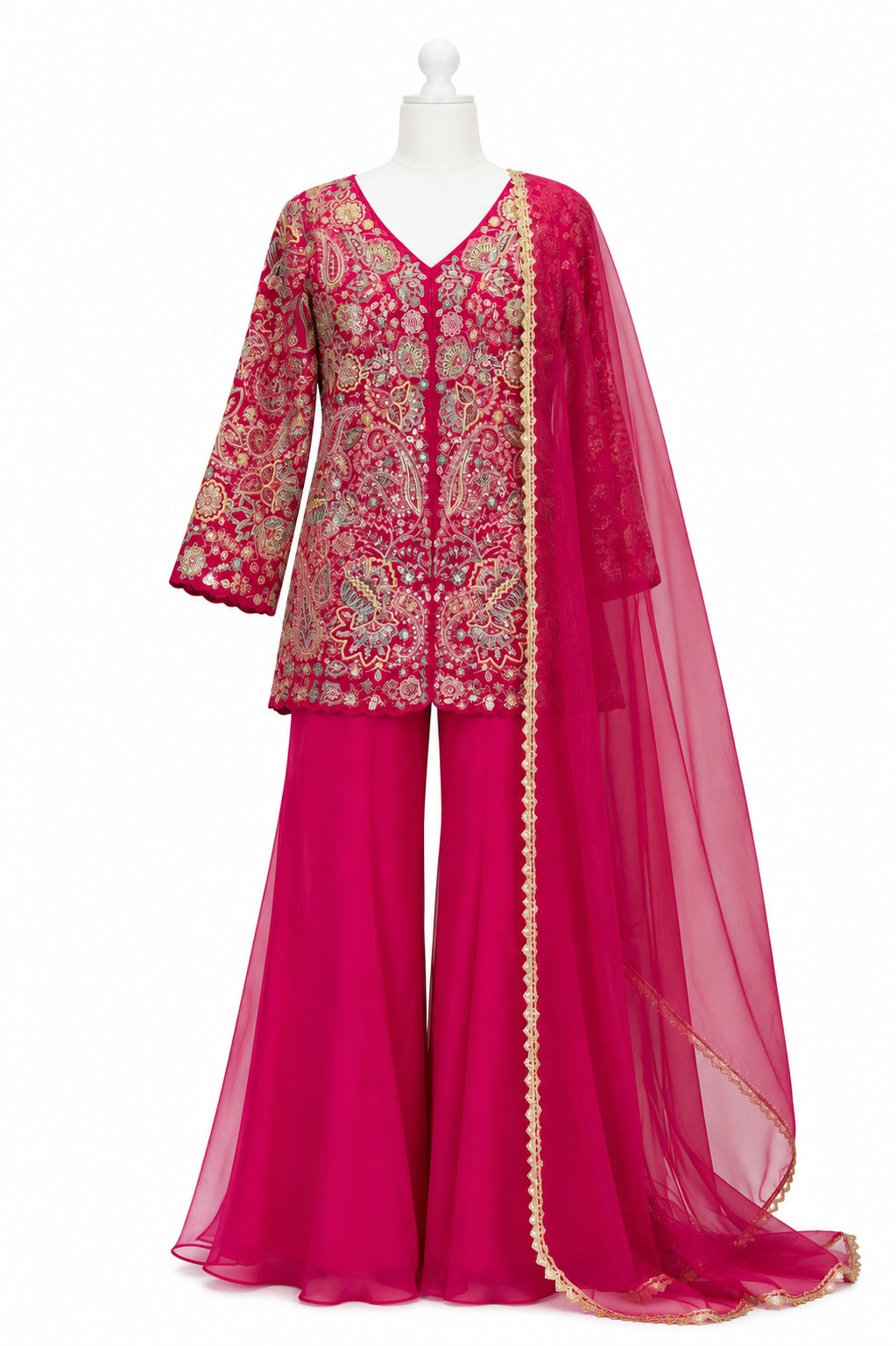 Pink traditional outfit with intricate embroidery on a mannequin against a white background