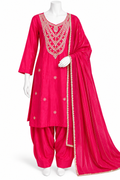 A bright pink traditional Indian salwar kameez suit displayed on a white mannequin. The set includes a pink kurta with intricate gold and silver embroidery around the neckline and scattered motifs on the front, matching pink salwar pants, and a sheer pink dupatta with a gold embroidered border.