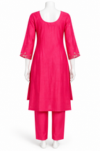 A bright pink cotton kurta set with matching trousers displayed on a white mannequin against a plain white background.
