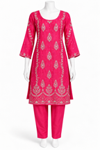 A bright pink traditional kurta set displayed on a white mannequin, featuring a heavily embroidered pink kurta with silver mirror-work and matching pink pants.