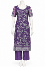 A purple kurta set with a silver floral brocade pattern and matching purple pants, displayed on a white mannequin against a white background.