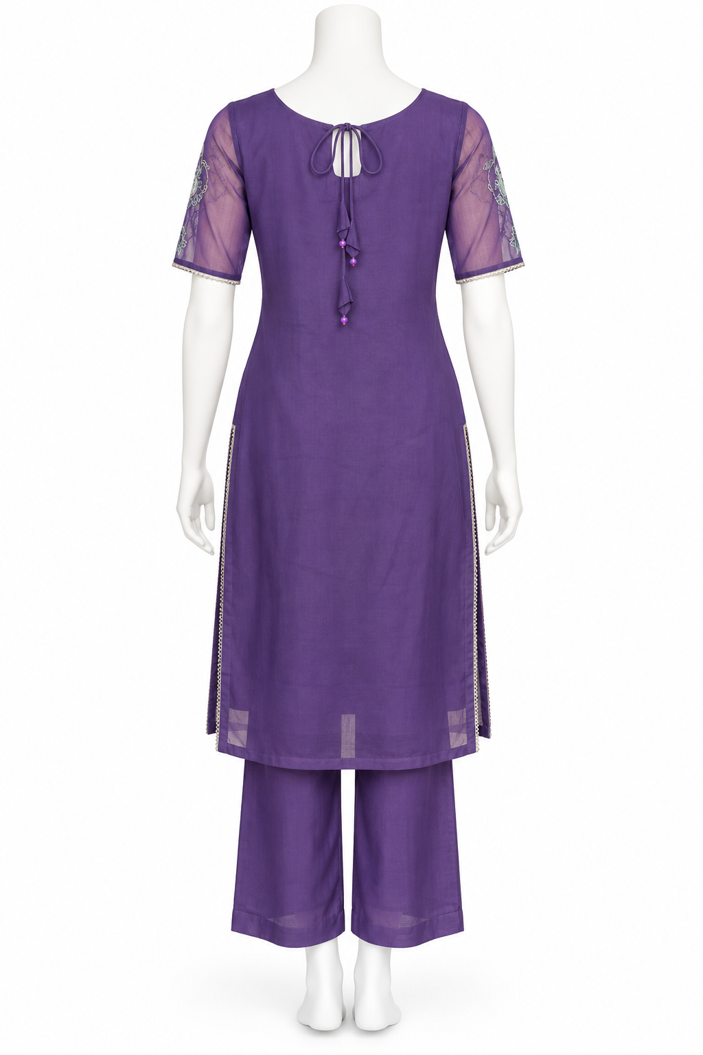 A purple two-piece kurta set displayed on a white mannequin, featuring a short-sleeve tunic with sheer mesh sleeves and a front tie detail, paired with matching wide-leg pants.