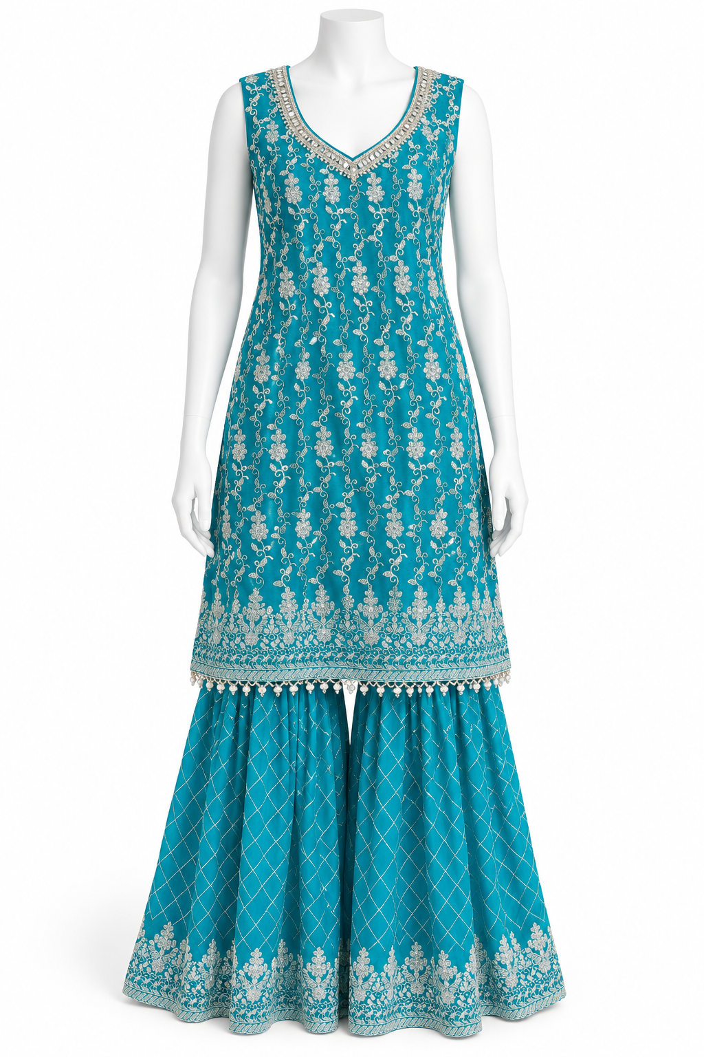 A sleeveless turquoise blue traditional outfit displayed on a white mannequin, featuring a heavily embroidered tunic with silver floral patterns and matching flared pants with decorative borders.