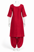 A red traditional Indian outfit consisting of a straight, knee-length tunic with elbow-length sleeves and matching loose harem pants, displayed on a white mannequin against a plain white background.