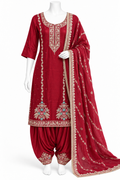 A red traditional Indian salwar kameez suit displayed on a white mannequin, featuring a heavily embroidered kameez kurta, matching pattharis, and a sheer dupatta with gold borders.