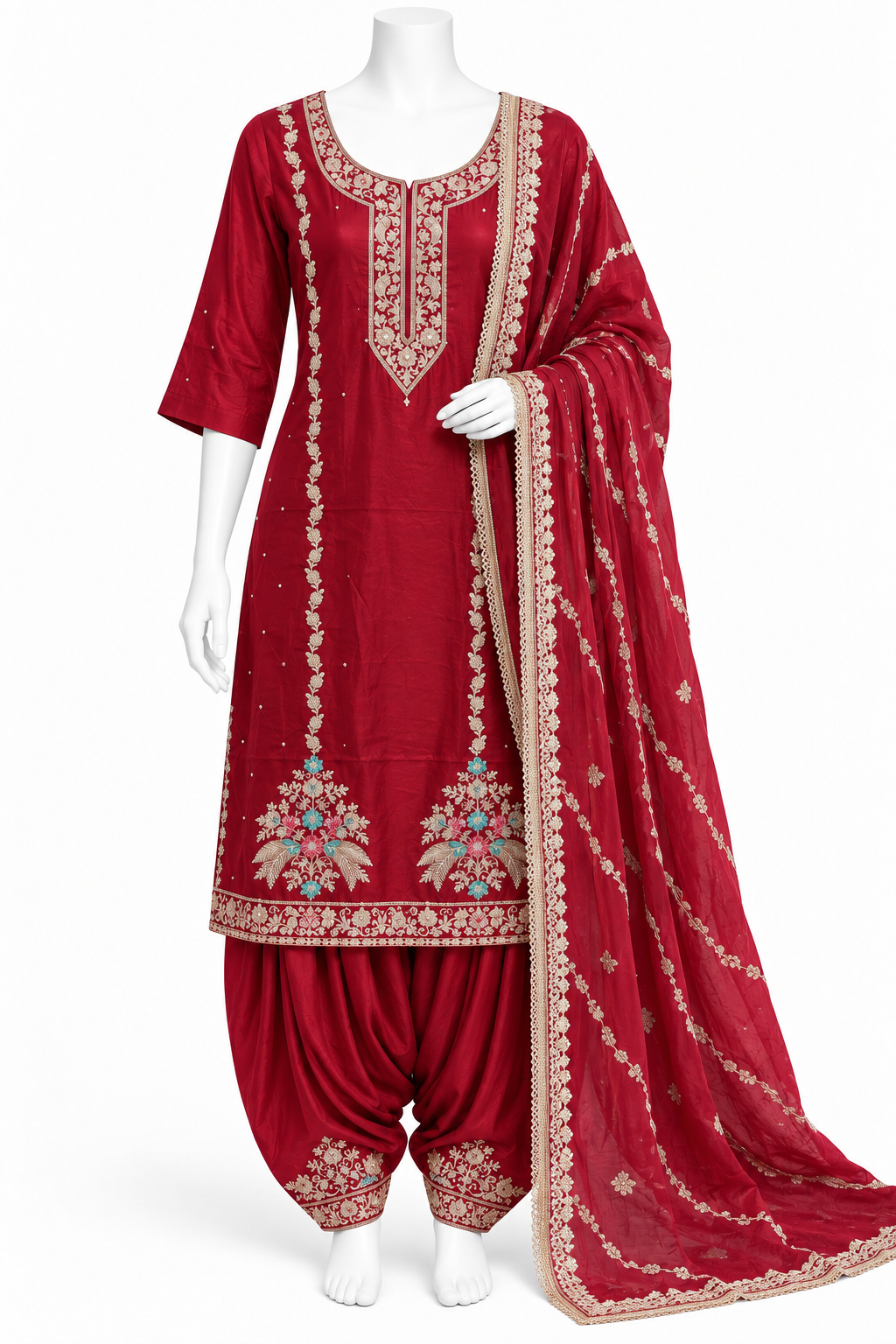A red traditional Indian salwar kameez suit displayed on a white mannequin, featuring a heavily embroidered kameez kurta, matching pattharis, and a sheer dupatta with gold borders.
