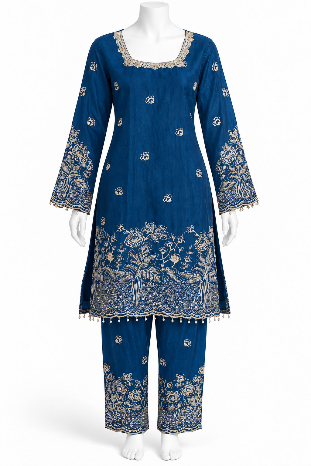 A blue traditional kurta and trouser set displayed on a white mannequin against a plain white background. The outfit features intricate gold floral embroidery concentrated around the neckline, sleeve cuffs, hem, and pant legs.