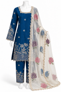 A three-piece Indian ethnic suit set displayed on a white mannequin. The set includes a royal blue kurta with gold floral embroidery, matching blue trousers, and a sheer off-white dupatta decorated with pink, purple, and blue floral embroidery and gold borders.