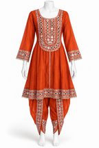 An orange traditional Indian kurta set displayed on a white mannequin, featuring intricate white, red, and black geometric embroidery around the neckline, sleeve cuffs, and hem, paired with matching embroidered palazzo pants.
