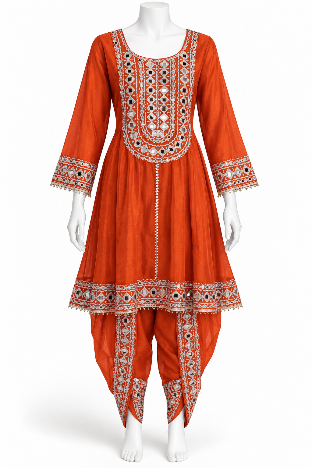 An orange traditional Indian kurta set displayed on a white mannequin, featuring intricate white, red, and black geometric embroidery around the neckline, sleeve cuffs, and hem, paired with matching embroidered palazzo pants.