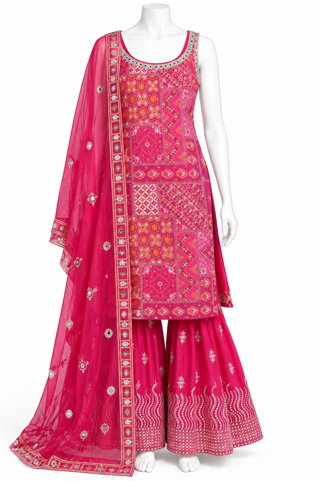 A bright pink traditional Indian outfit displayed on a white mannequin, featuring a heavily embroidered kurta, matching flared pants, and a sheer embroidered dupatta.